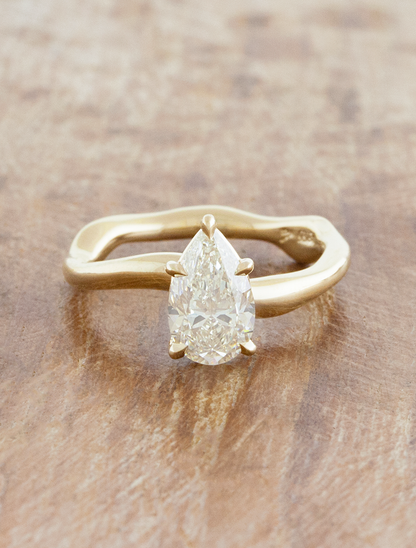 caption:Shown with 1.2ct pear diamond in 14k yellow gold 