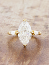 caption:Shown with 3ct marquise in 14k yellow gold 