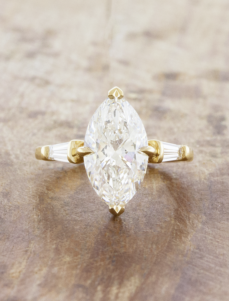 caption:Shown with 3ct marquise in 14k yellow gold 