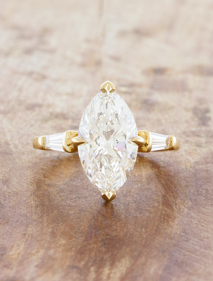 caption:Shown with 3ct marquise in 14k yellow gold 