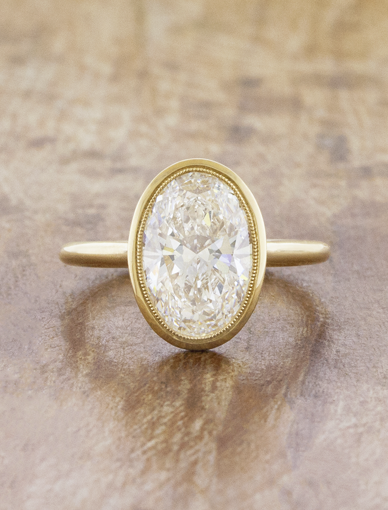 caption:Shown with 3ct oval in 14k yellow gold