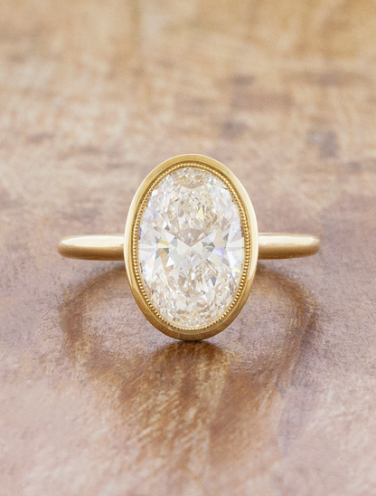 caption:Shown with 3ct oval in 14k yellow gold