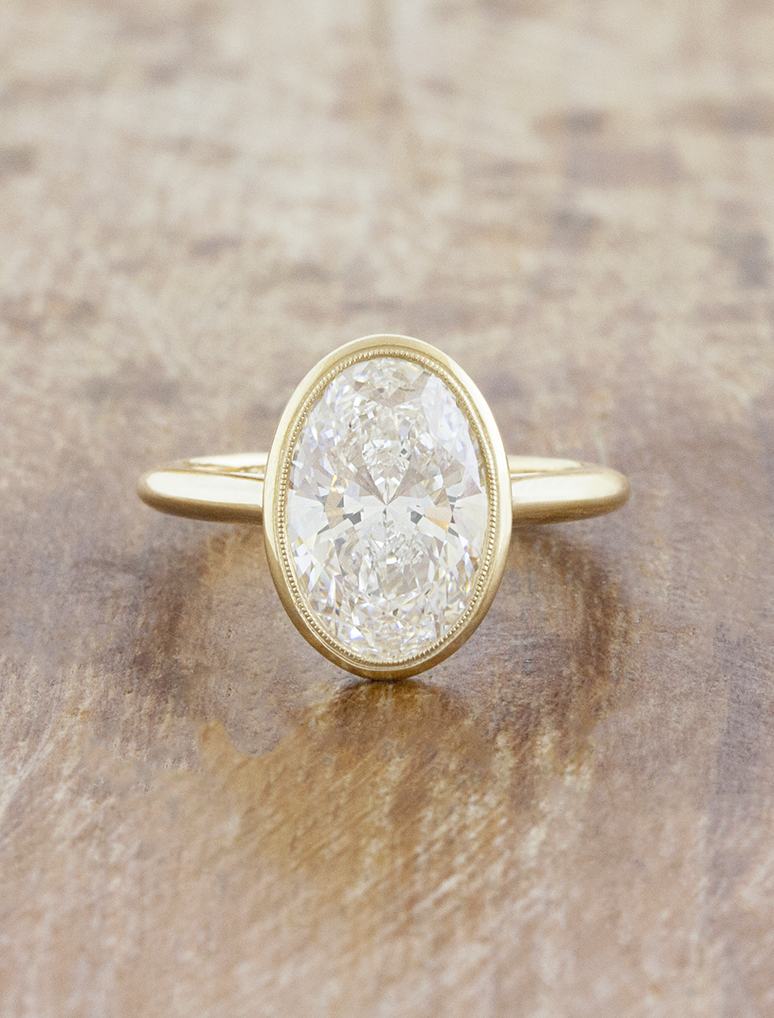caption:Shown with 3ct oval in 14k yellow gold 