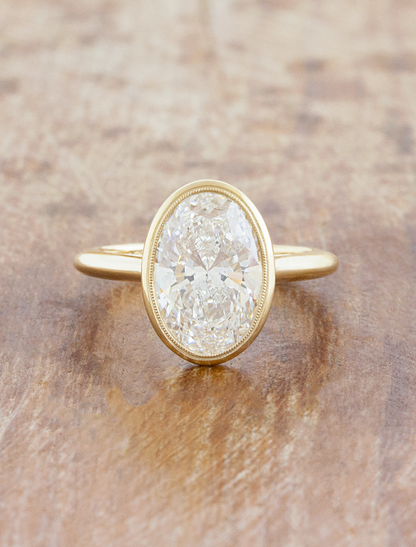 caption:Shown with 3ct oval in 14k yellow gold 