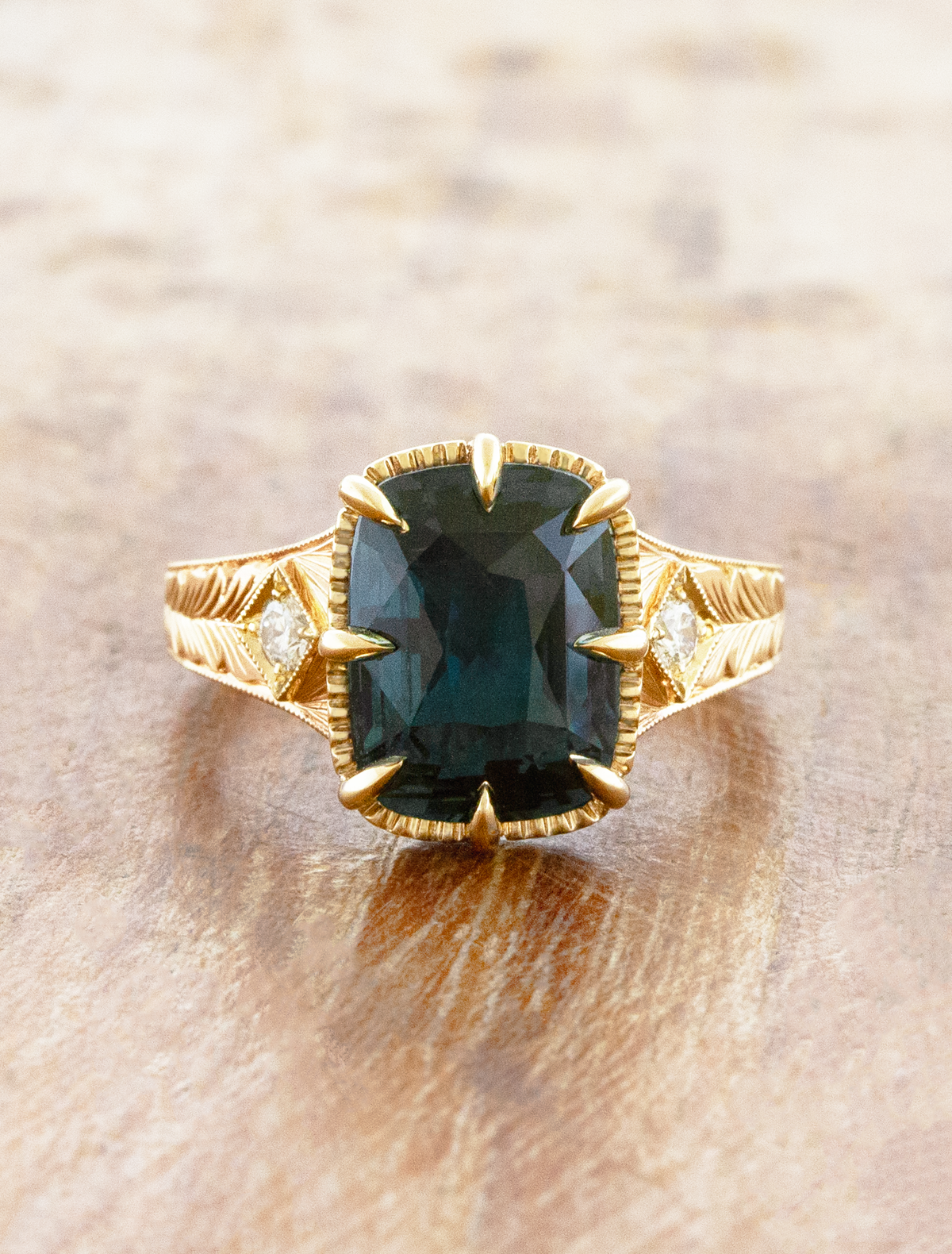 caption:Shown with 4.6ct cushion sapphire in 14k yellow gold