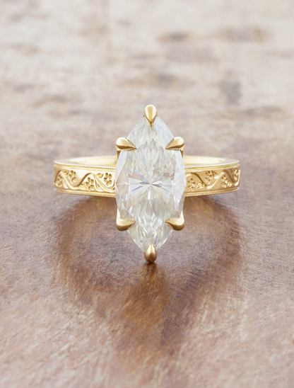 caption:Shown with 2.7ct marquise in 18k yellow gold 