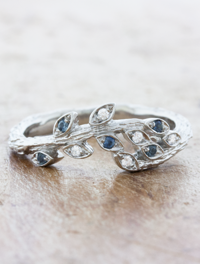 caption:Customized with blue sapphires in platinum