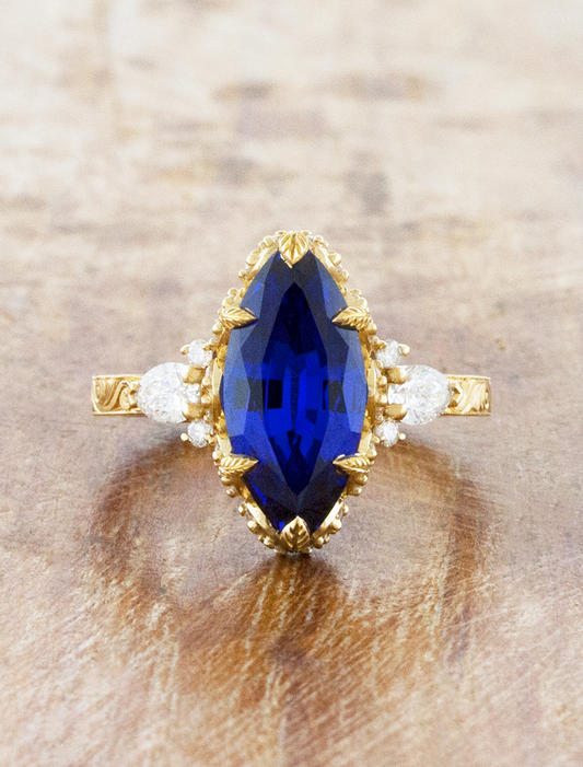 caption:Shown with 15 x 7mm marquise sapphire in 14k yellow gold