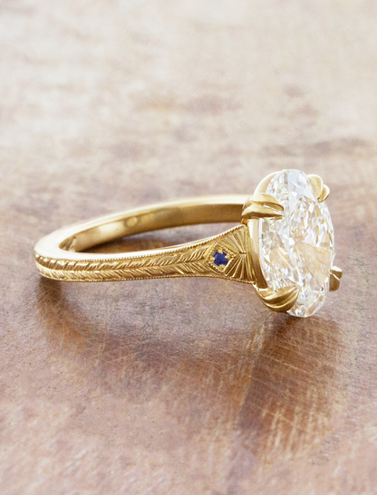 caption:Designed with blue sapphire accents