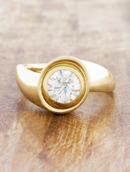 caption:Shown with 1ct round cut in 14k yellow gold 