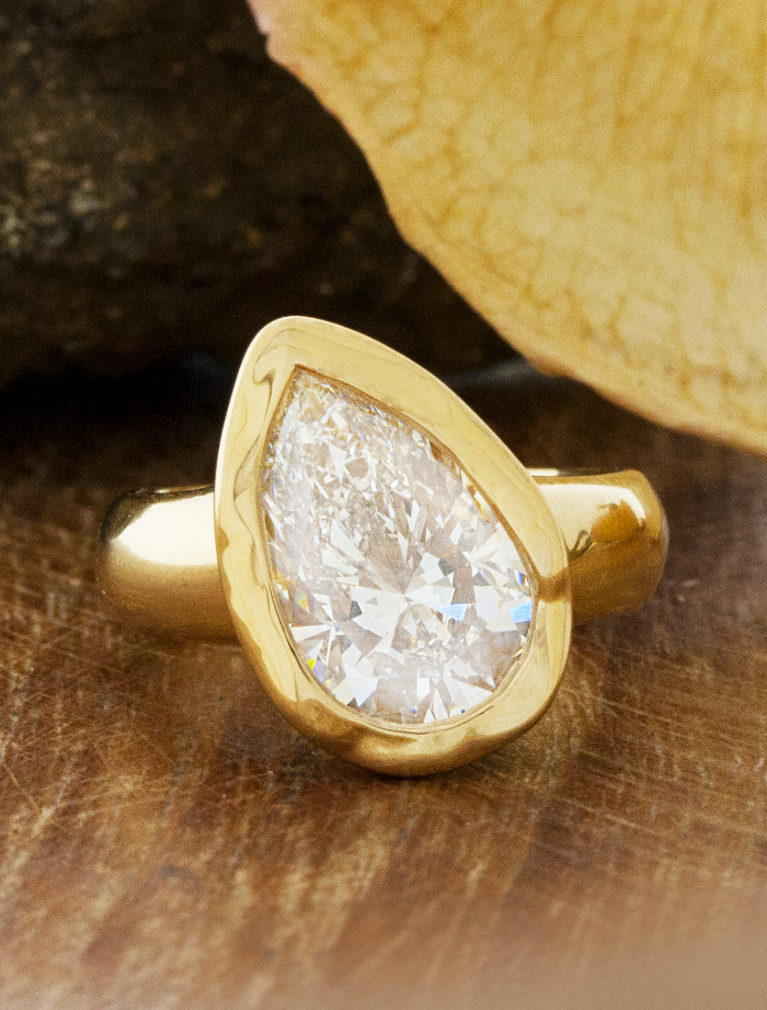 caption:Shown with 3ct pear diamond in 18k yellow gold