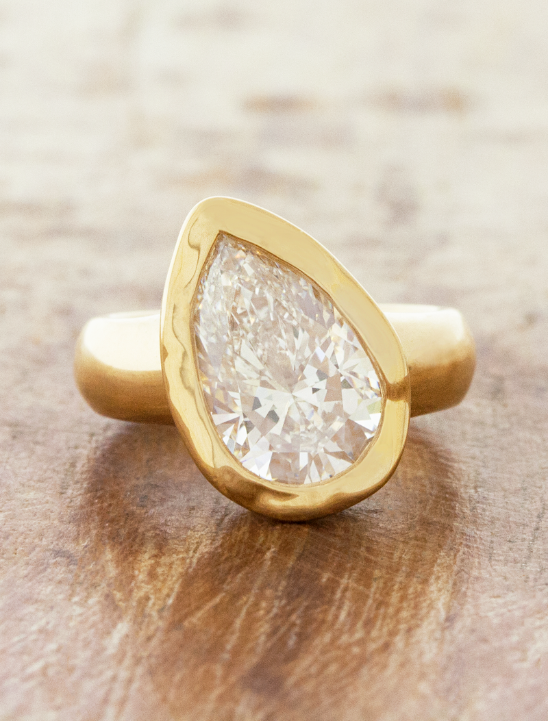 caption:Shown with 3ct pear diamond in 18k yellow gold