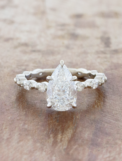 caption:Shown with 1.7ct pear in 14k white gold 