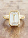 caption:Shown with 4ct emerald cut in 14k yellow gold