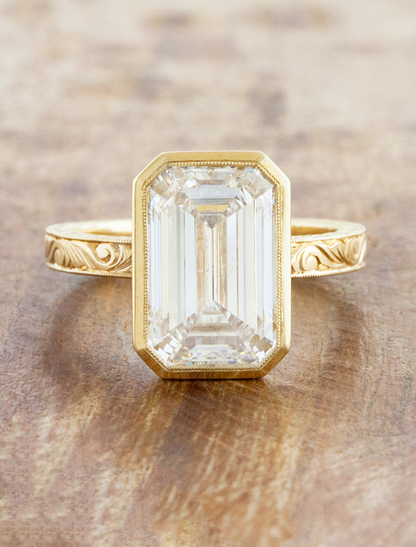 caption:Shown with 4ct emerald cut in 14k yellow gold