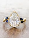 caption:Shown with 4.2ct pear diamond in yellow gold