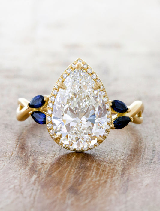 caption:Shown with 4.2ct pear diamond in yellow gold
