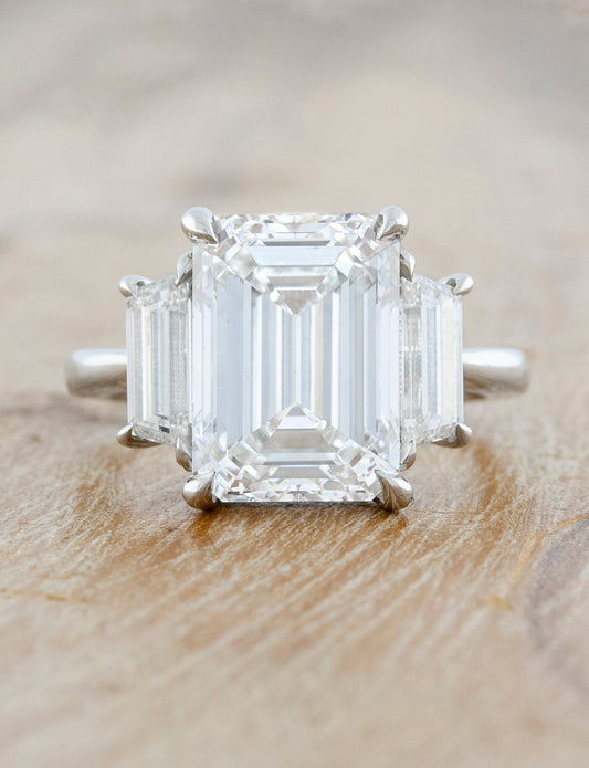 caption:Shown with 5ct emerald cut diamond in platinum