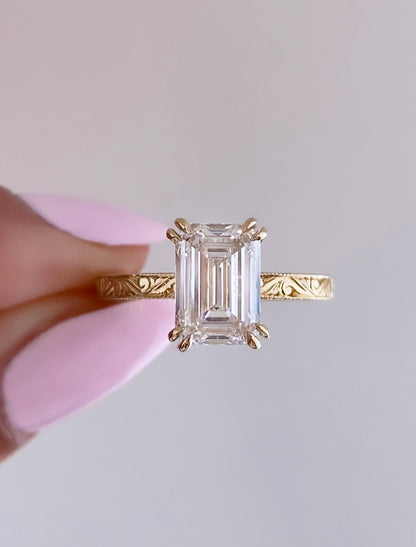 caption:Shown with 2ct emerald cut