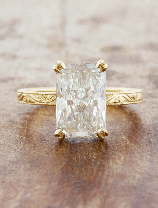 caption:Shown with 3ct radiant cut in 14k yellow gold