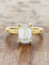 caption:Shown with 1.5ct emerald cut in 14k yellow gold