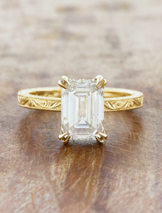 caption:Shown with 1.5ct emerald cut in 14k yellow gold