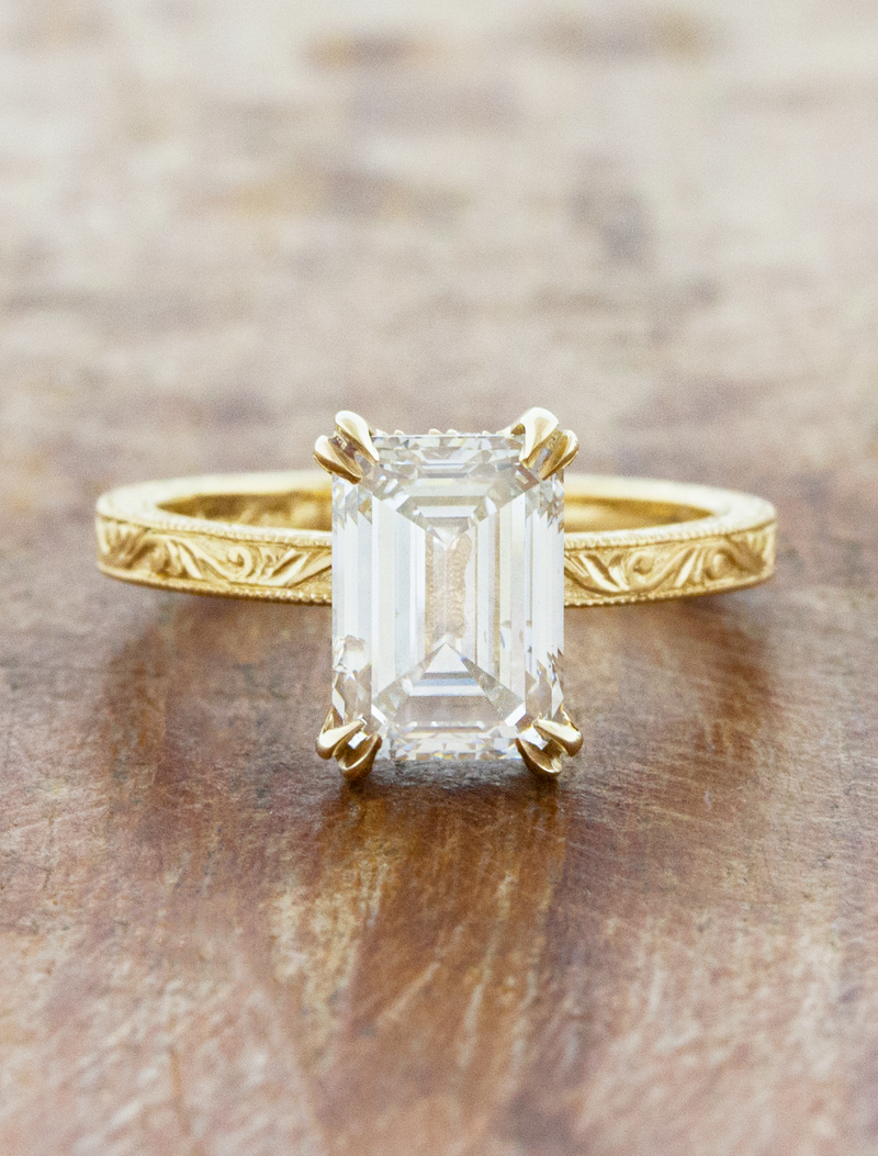 caption:Shown with 1.5ct emerald cut in 14k yellow gold