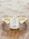 caption:Shown with 3ct emerald cut diamond in 14k yellow gold