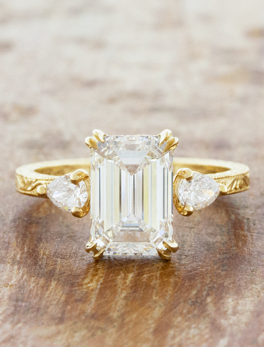 caption:Shown with 3ct emerald cut diamond in 14k yellow gold