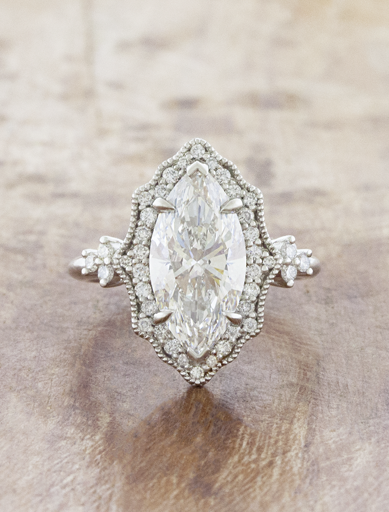 caption:Shown with 3ct marquise in platinum
