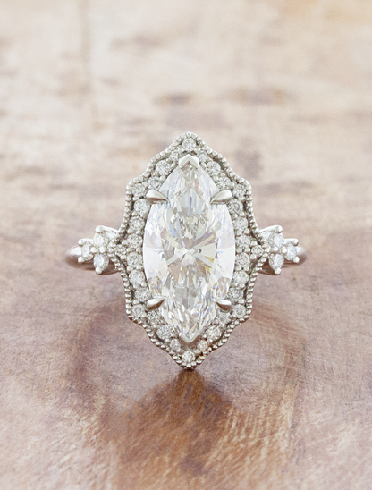 caption:Shown with 3ct marquise in platinum