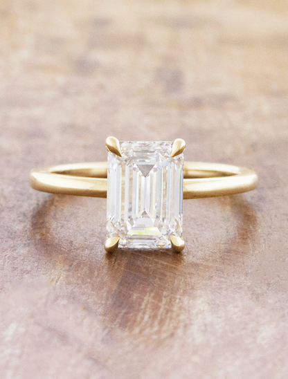 caption:Shown with 1.78ct emerald cut in 14k yellow gold 