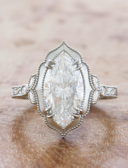 caption:Shown with 2.5ct marquise in platinum