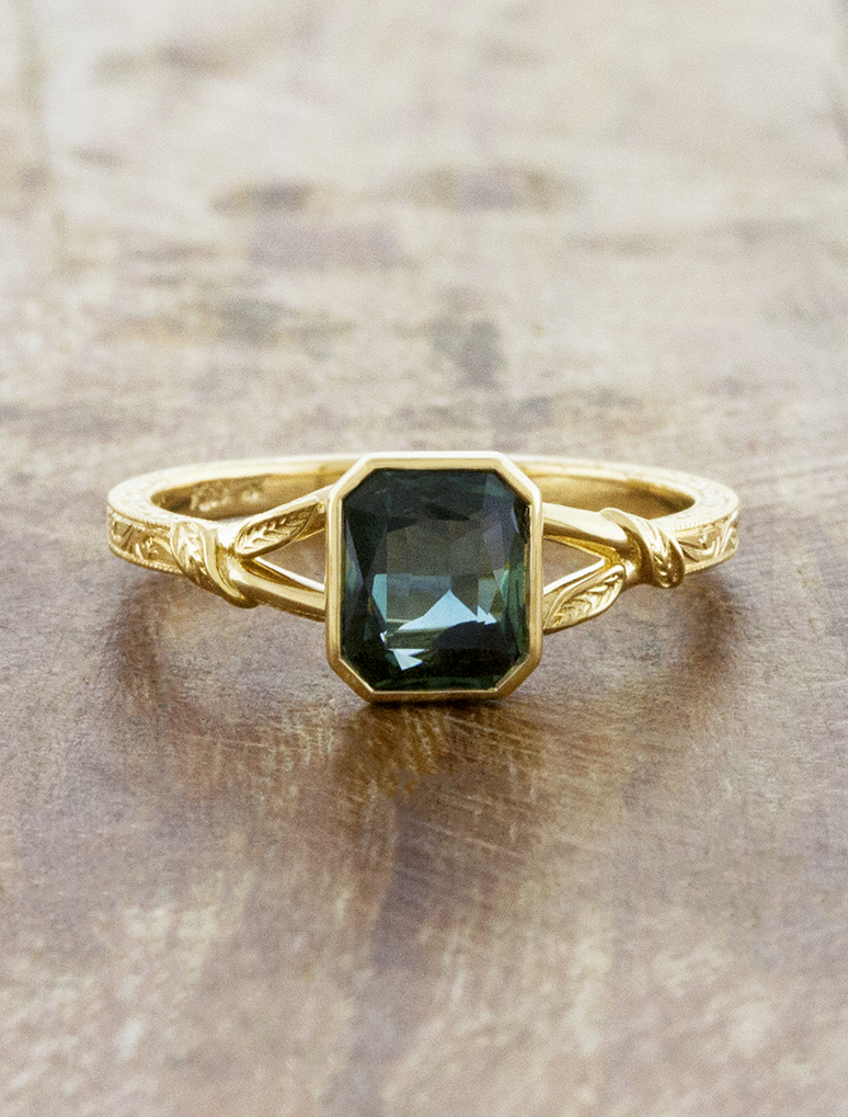 caption:Shown with 1.5ct emerald cut sapphire in 18k yellow gold 