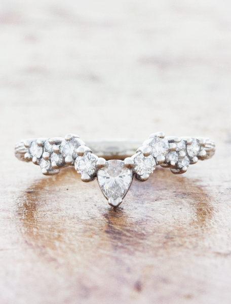 Curved clustered wedding band with bark texture