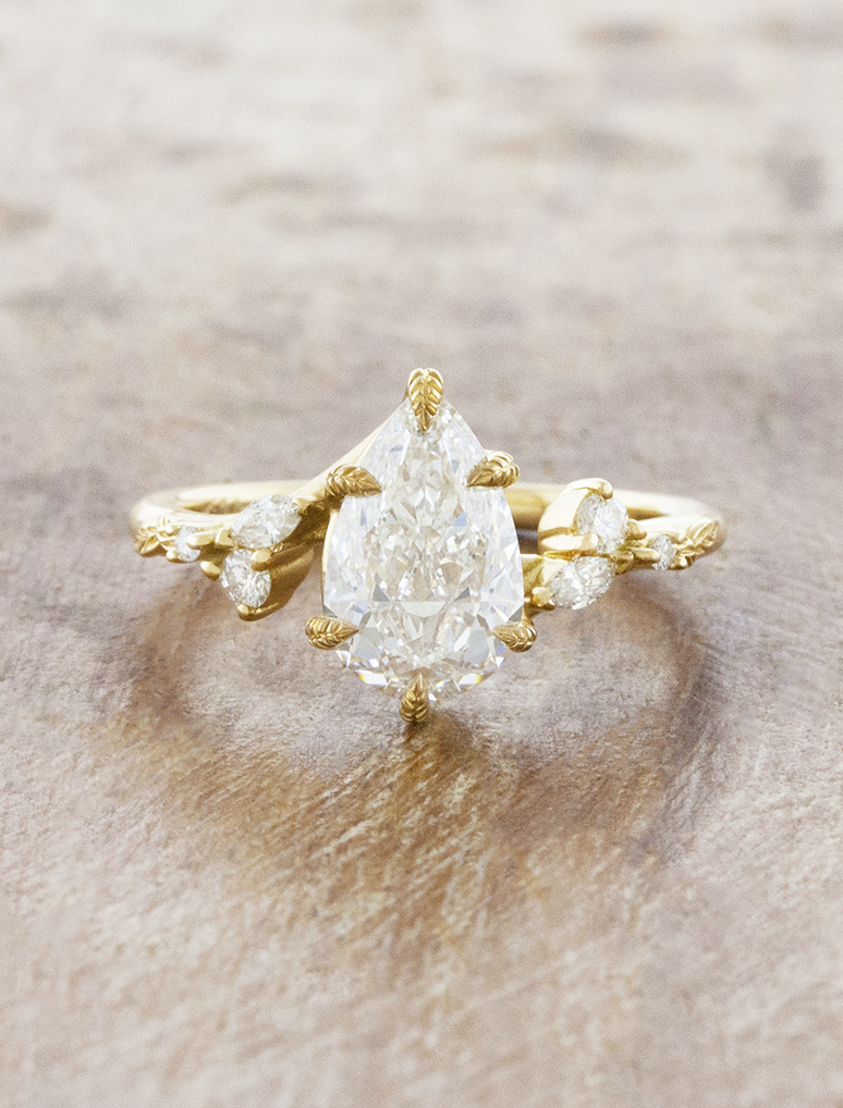 caption:Shown with 1.5ct pear in 18k yellow gold