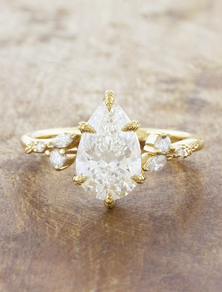 caption:Shown with 2ct pear in 14k yellow gold 