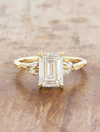 caption:Shown with 3ct emerald cut in 14k yellow gold 