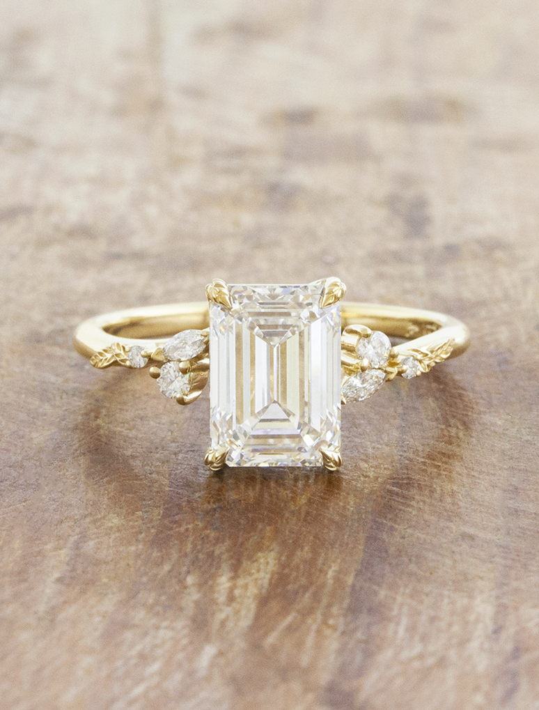 caption:Shown with 3ct emerald cut in 14k yellow gold 