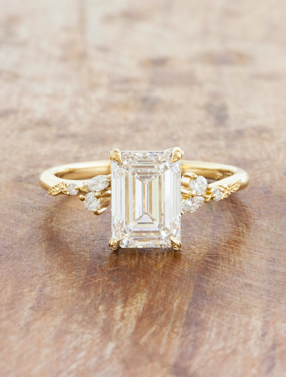 caption:Shown with 3ct emerald cut in 14k yellow gold 
