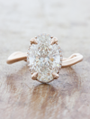 caption:Shown with 2.40ct oval diamond in platinum