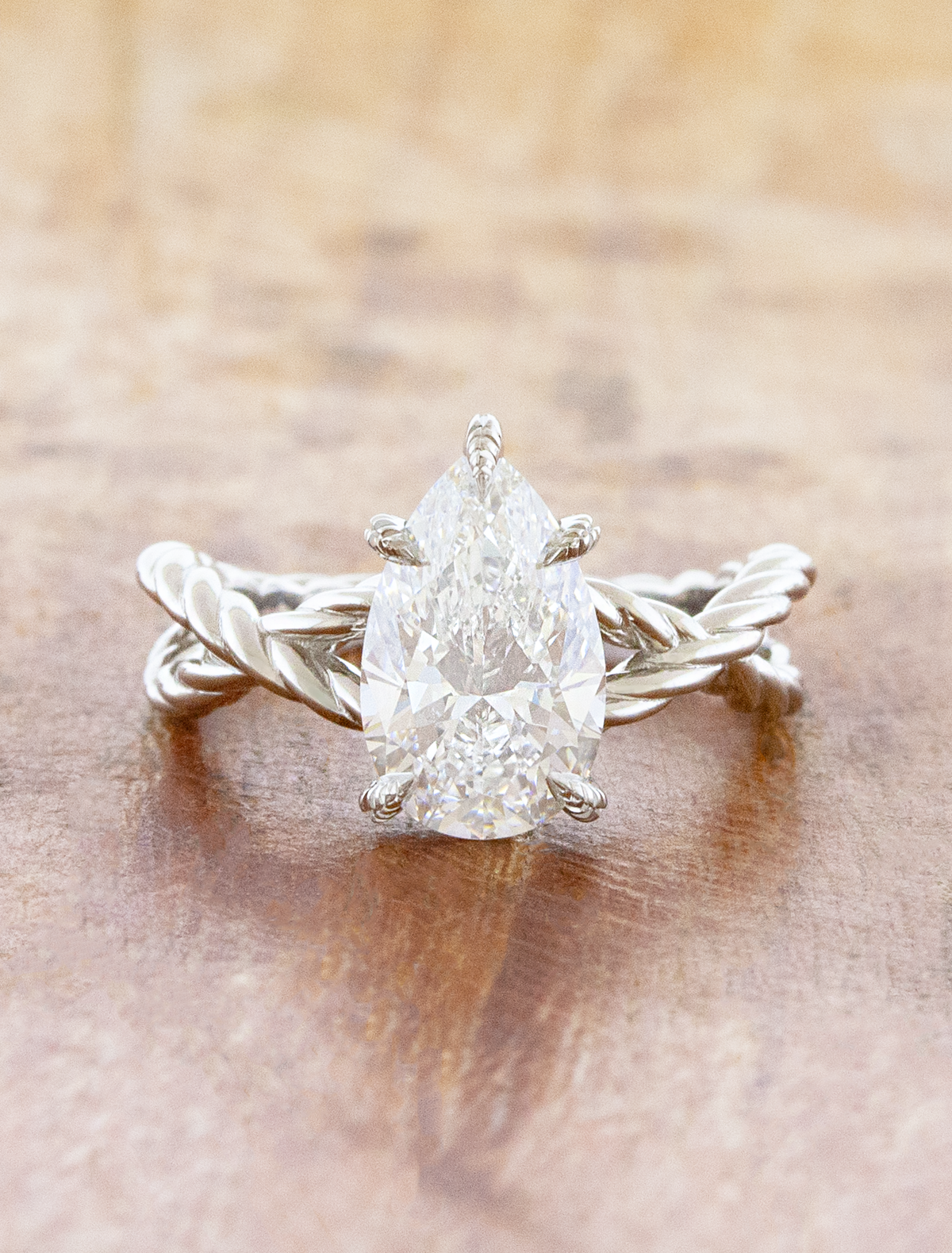 caption:Shown with 2ct pear in platinum