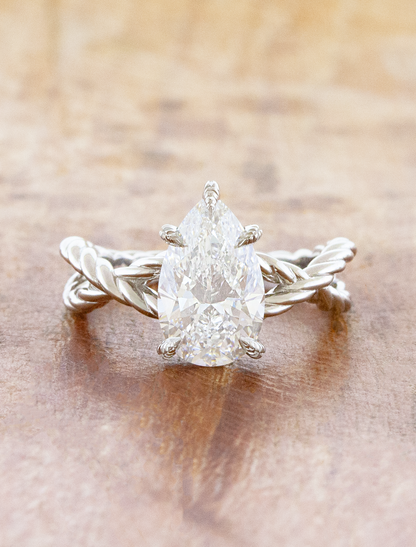 caption:Shown with 2ct pear in platinum
