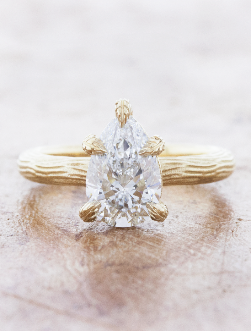 caption:Shown with 1.50ct pear diamond in 14k yellow gold