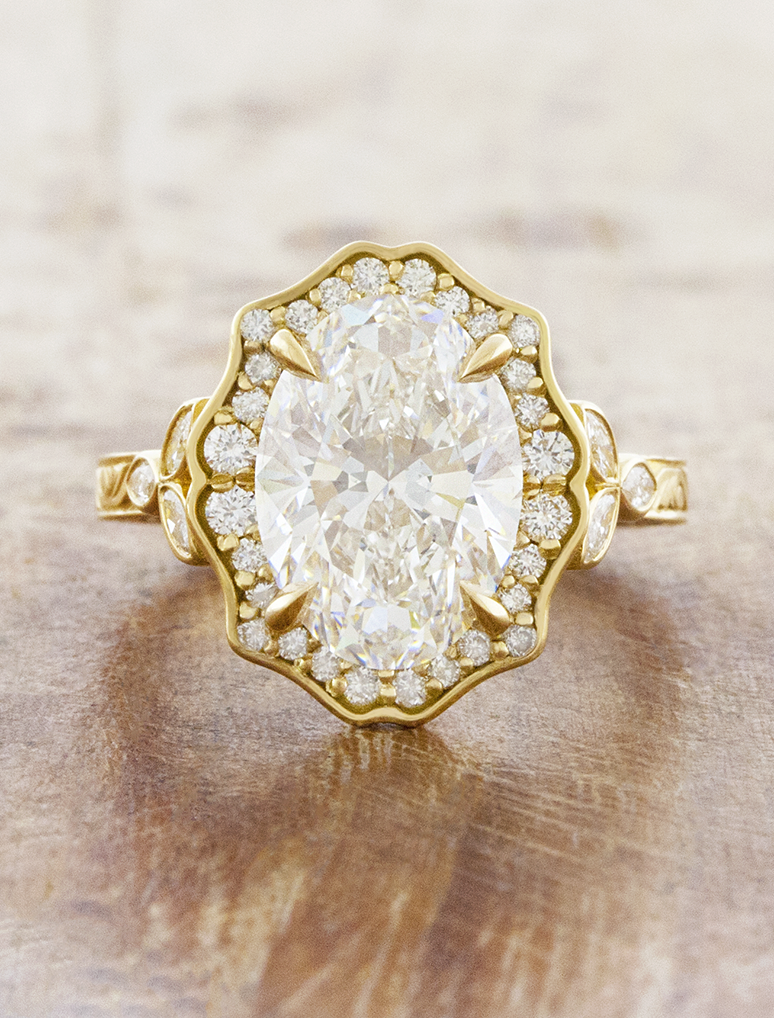 caption:Shown with 3ct oval in 18k yellow gold 