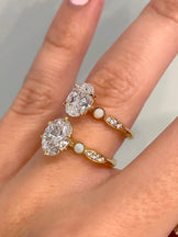 Laura: Three Stone Oval Diamond Ring with Opal Side Stones | Ken & Dana