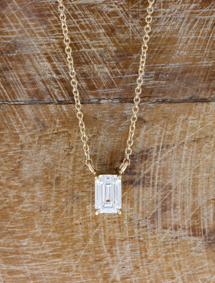 caption:Shown with 0.85ct emerald cut diamond in 14k yellow gold