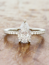 caption:Shown with 1.5ct pear diamond in platinum