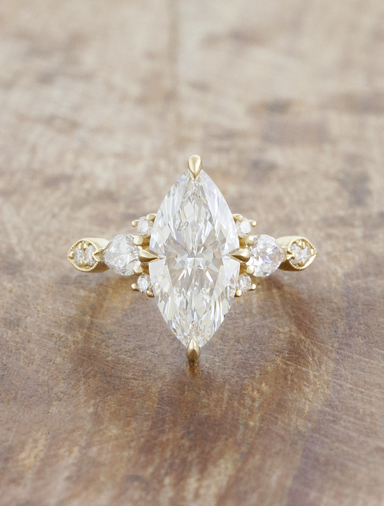 caption:Shown with 2ct marquise in 14k yellow gold 