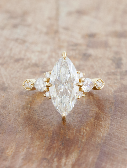 caption:Shown with 2ct marquise in 14k yellow gold 